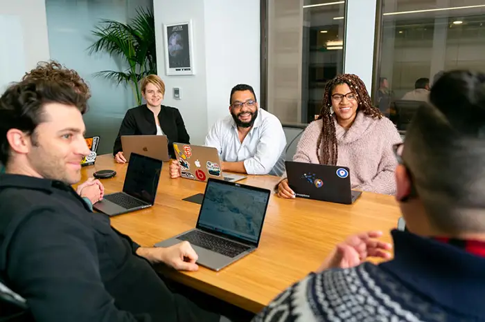 team at table smiling